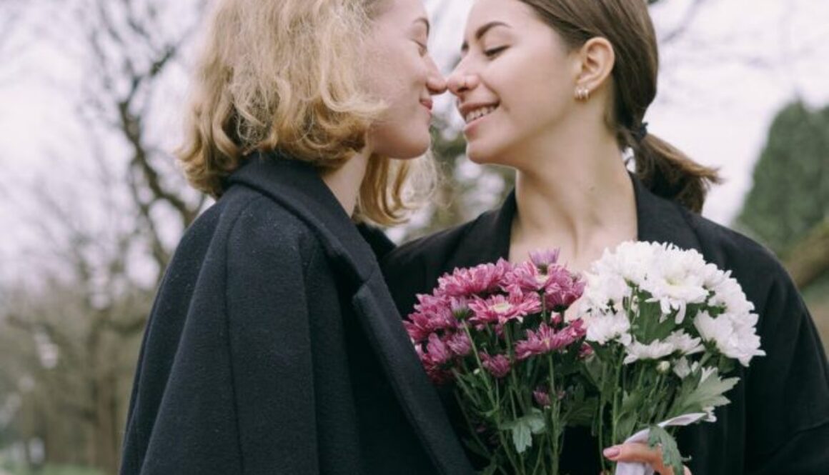 a happy couple holding flowers