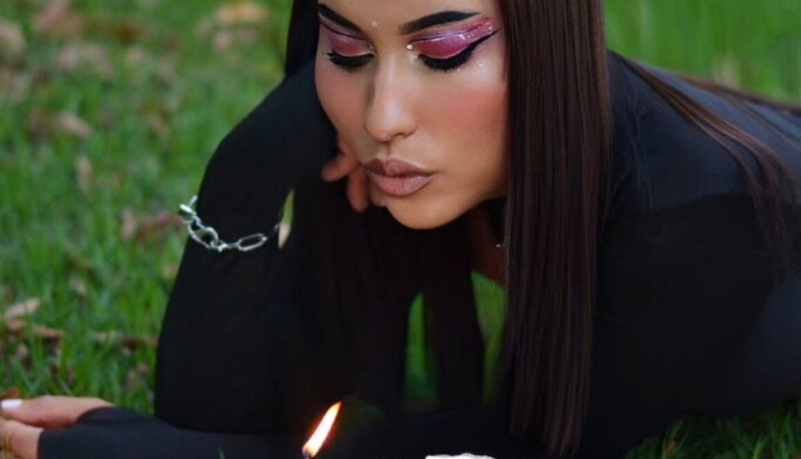 woman blowing candle on birthday cake