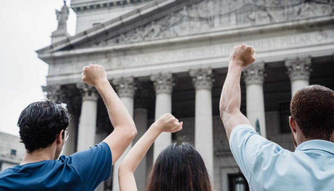 men and a woman protesting in front of the supreme court of the united states