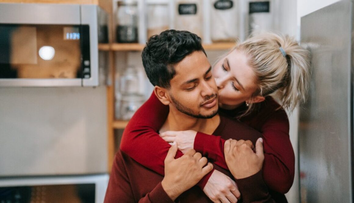 woman kissing a man on the cheek