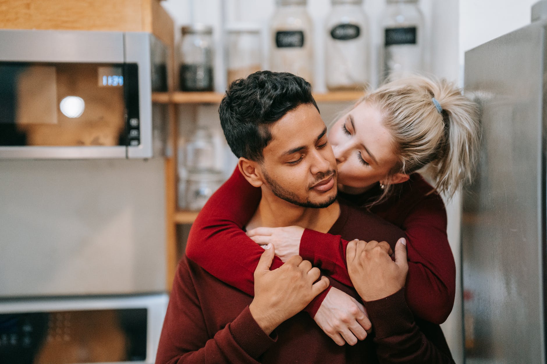 woman kissing a man on the cheek